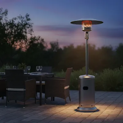 A powerful AmazonBasics 46,000 BTU propane patio heater warming an outdoor dining area at dusk.