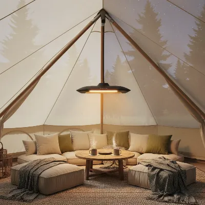 A modern hanging electric infrared patio heater suspended inside a large, luxurious glamping tent, providing soft, ambient warmth to a cozy seating area with blankets and cushions.